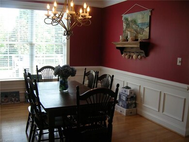Large Dining room with picture frame moulding under chair rail. Great for those extended family gatherings