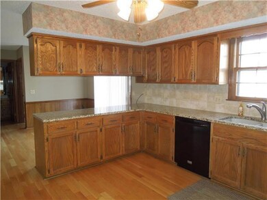 Tons of cabinet space with beautiful granite count