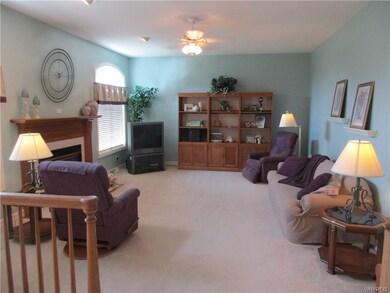 Step down to the family room with arched transom w