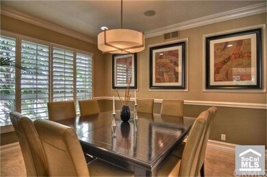 Custom moldings adorn the large formal dining room