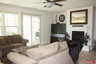 View of family room with fireplace, views, and acc