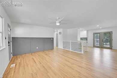 Spare room featuring ceiling fan, light wood-style flooring, french doors, and recessed lighting