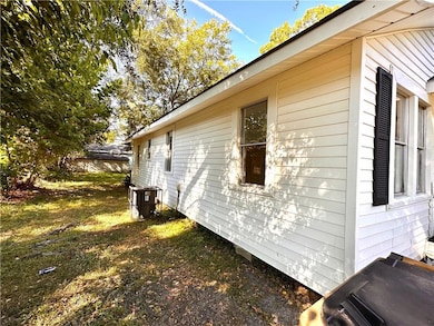 View of property exterior with a central air condition unit