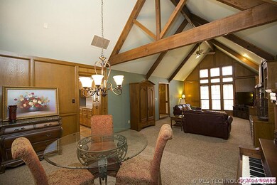 Cross beamed ceiling separates great room from ope