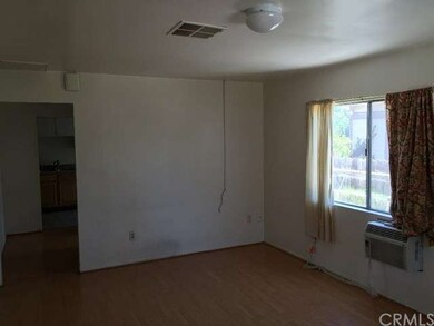 Living Room with wall AC Unit