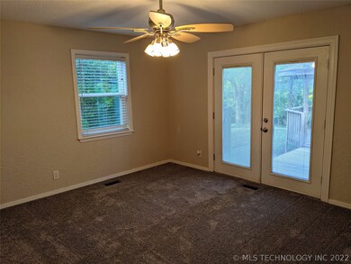 Master bedroom with French doors to deck/gazebo.