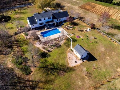 The backyard is a dream with an in-ground pool, po