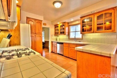 Large kitchen with wood/glass cabinets
