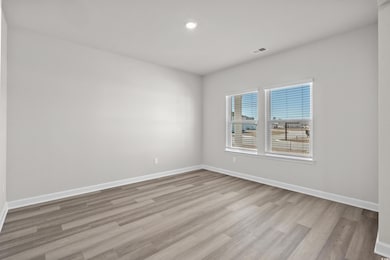 Empty room with recessed lighting, light wood-styl