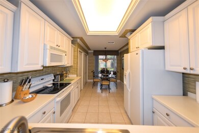 Kitchen featuring light tile patterned flooring, d