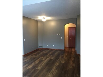 Other view of Large Living Room with door leading 