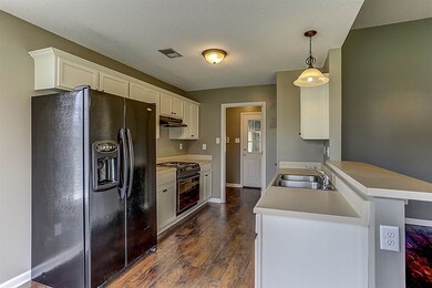Freshly painted cabinets, New hardware, New flooring, and appliances stay