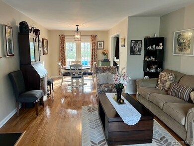 Living room featuring an inviting chandelier and h