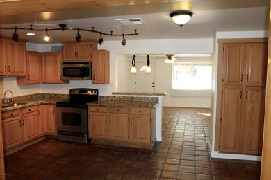 Granite counters with custom cabinets.