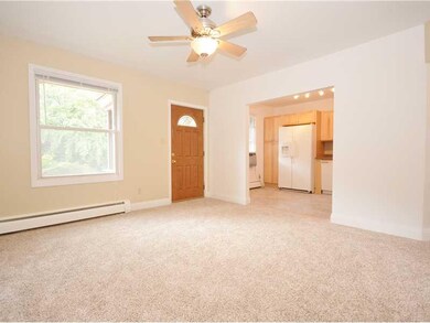 Living Room. The wide entry into the kitchen is sh