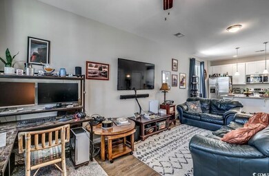 Living room with light hardwood / wood-style floor