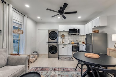 Kitchen featuring tasteful backsplash, appliances 