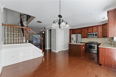 Kitchen featuring a sink, stainless steel applianc