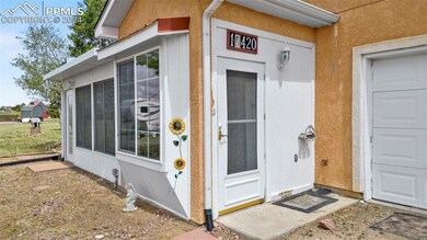 Doorway to property with a garage