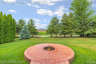 Large yard and cozy firepit for summer and fall evenings