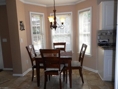 Kitchen nook overlooking the back yard and open to the family room.