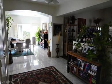 Formal entry looks into Dining/Den and Living room