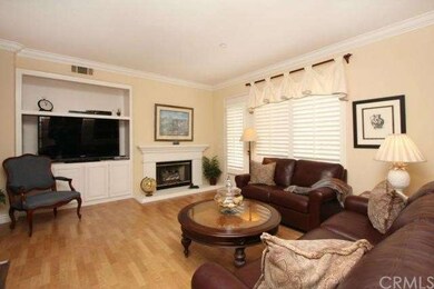 Large family room has side door with shutters that
