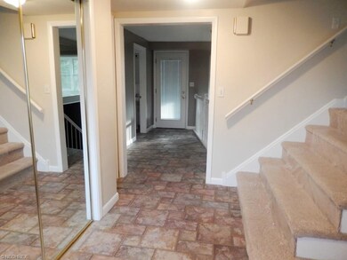 Foyer entry with ceramic tile floor.