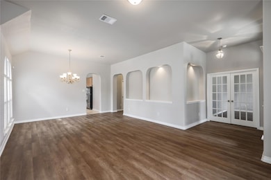 Unfurnished room featuring dark wood finished flo
