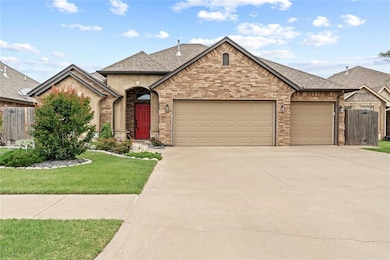 French provincial home with an attached garage, concrete driveway, roof with shingles, and brick siding