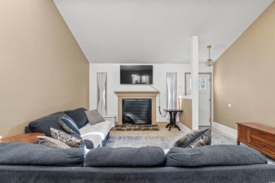Living room featuring lofted ceiling and light til