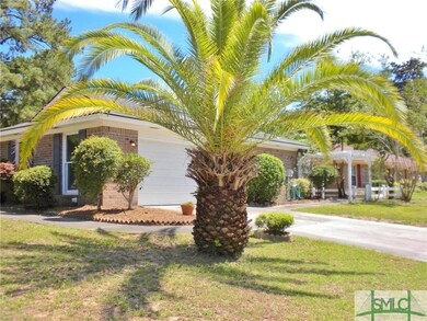 Side entry garage---beautifully manicured yard.