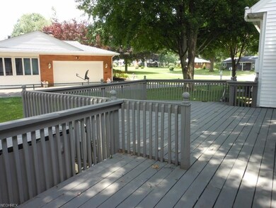 Nice large deck with view of partially fenced yard