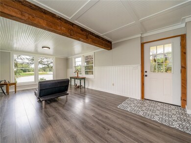 Front door opens to living room. Views of the rive