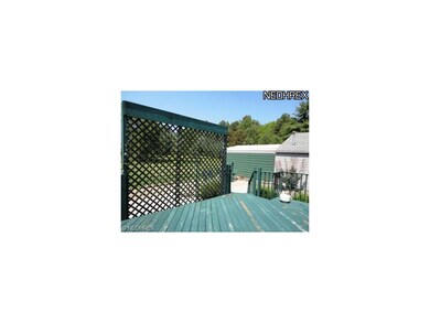 The back deck to the right, showing the garage wit