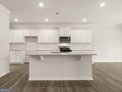 halton kitchen with granite countertops and updated white tiled backsplash