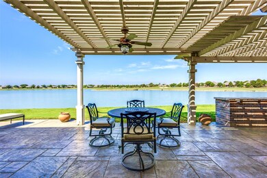 Backyard and Patio View of Lake and Golf Course.