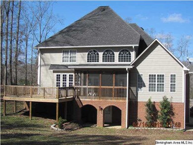 The rear of this lovely home has an oversized deck