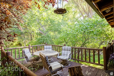 Wooden deck featuring outdoor dining space