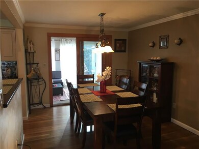 The dinning room leads to the three season room wh