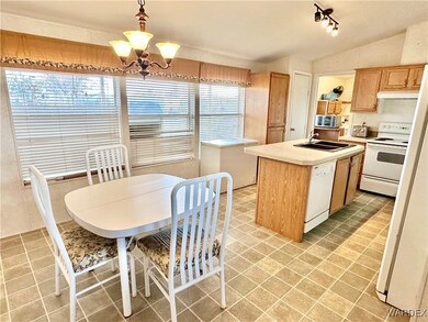 Kitchen and dining room area with a center island.