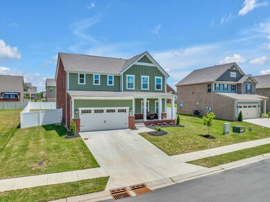 Wide driveway that can hold at least 2 cars and a 2 car garage....