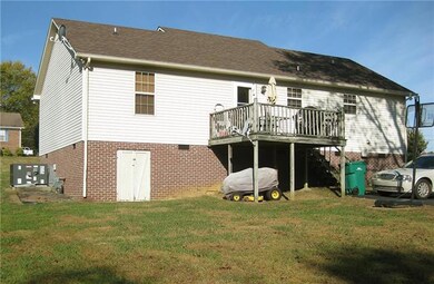 Deck off rear of home and additional parking.