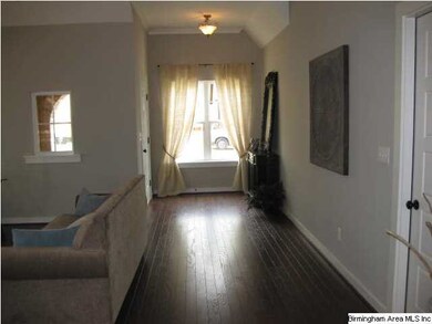 Hall/great room leading to foyer and front door.