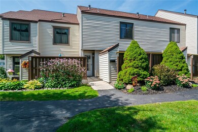 Separate entry with plush landscaping
