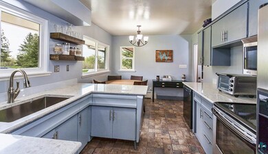 Updated kitchen features Quartz countertops, tile 