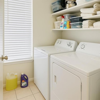 Laundry area featuring washing machine and dryer 