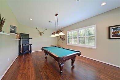 24x14 game room with Pergo flooring, plantation sh
