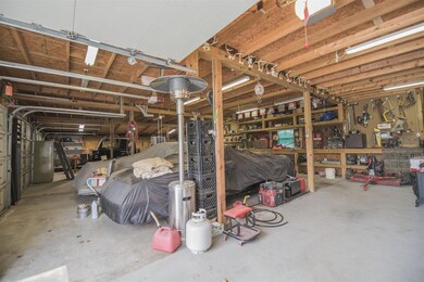 Detached garage w/6 bays, floored attic space the length of the 1st 3 bays. 