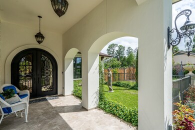 Polished travertine entry with double custom iron